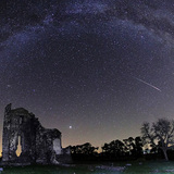 Perseid meteor streaking across the sky with Jupiter in the background