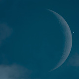 Crescent of the Moon and Venus next to each other