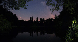 Reflection of Jupiter and the Milky Way in a lake