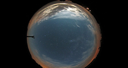 View of the setting moon through a fish-eye lens
