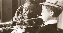 Louis Armstrong, the great jazz trumpeter with one of his students