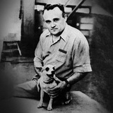 Sergei Korolev, the founder of the Soviet space program, with a dog that has returned from an experimental rocket flight (1954)