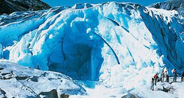 Glacial stream coming out from a glacier cave entrance