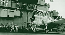Fighter plane taking off from an American aircraft carrier