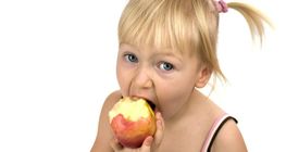 A girl eating an apple