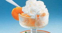 Cup of fruit with whipped cream